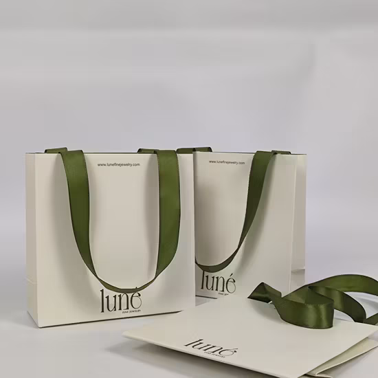 Túi giấy cá nhân hóa chất lượng cao dành cho mua sắm, quà tặng và đựng quần áo với nơ và tay cầm