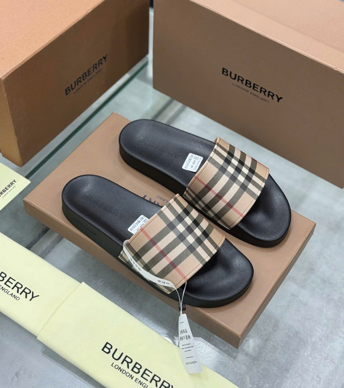 Dép lê quai ngang Burberry BBR Nâu kẻ sọc basic Like Auth on web fullbox bill thẻ DDT