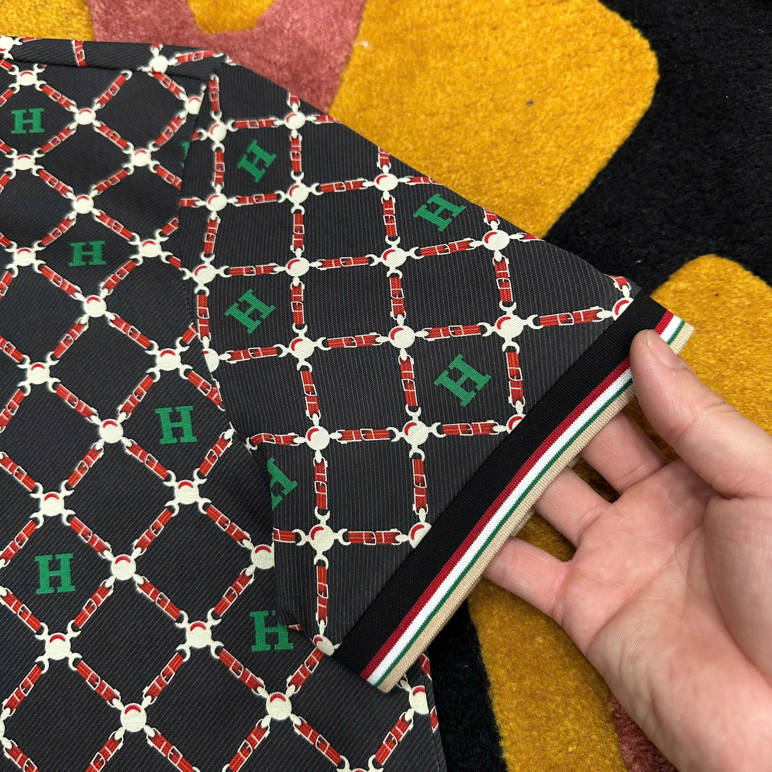 Áo polo Hermes HM Đen họa tiết logo chữ Xanh kẻ sọc Đỏ  Like Auth MK