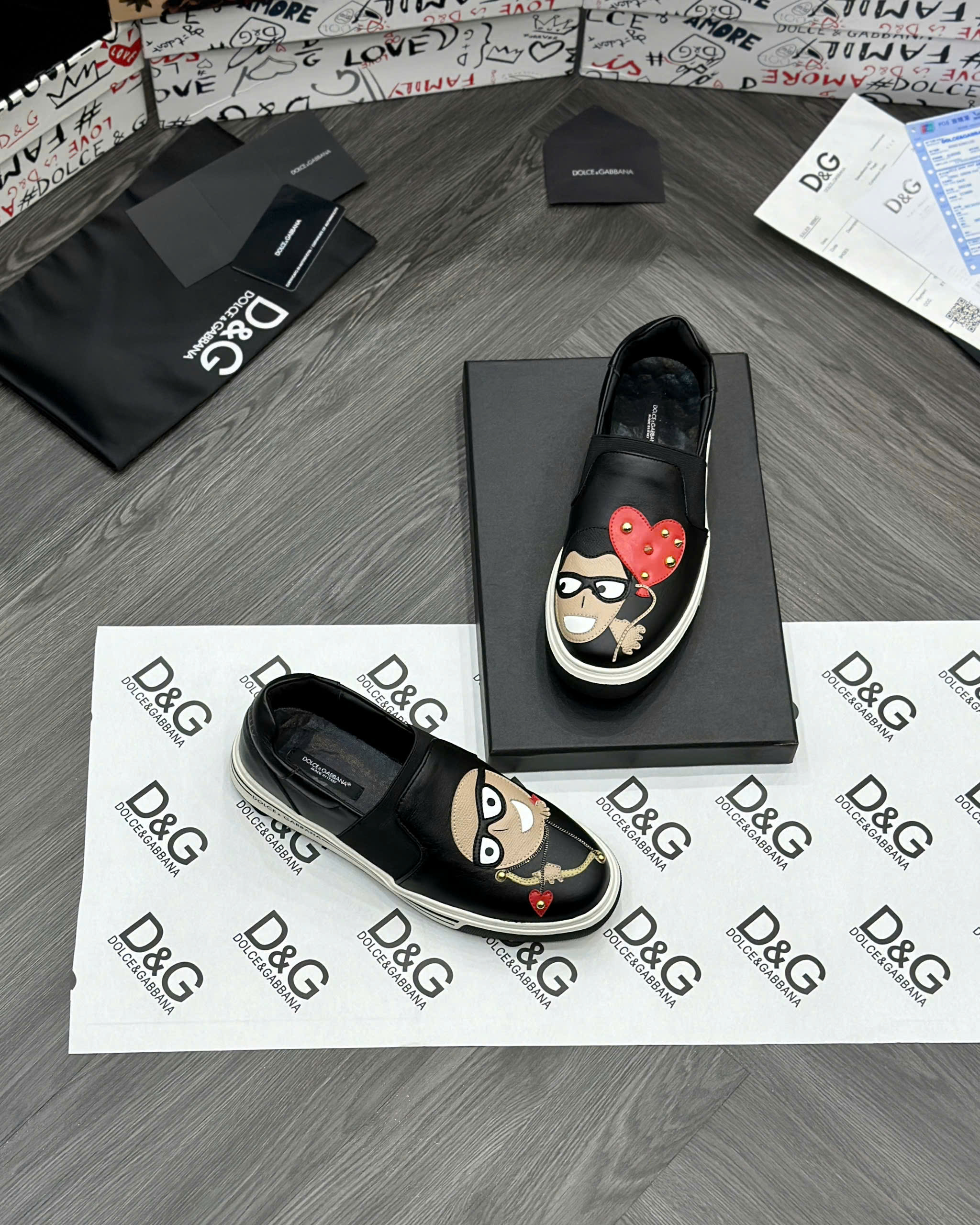 Giày slipon Dolce Gabbana DG Đen mặt người bắn cung trái tim Like Auth fullbox MVT