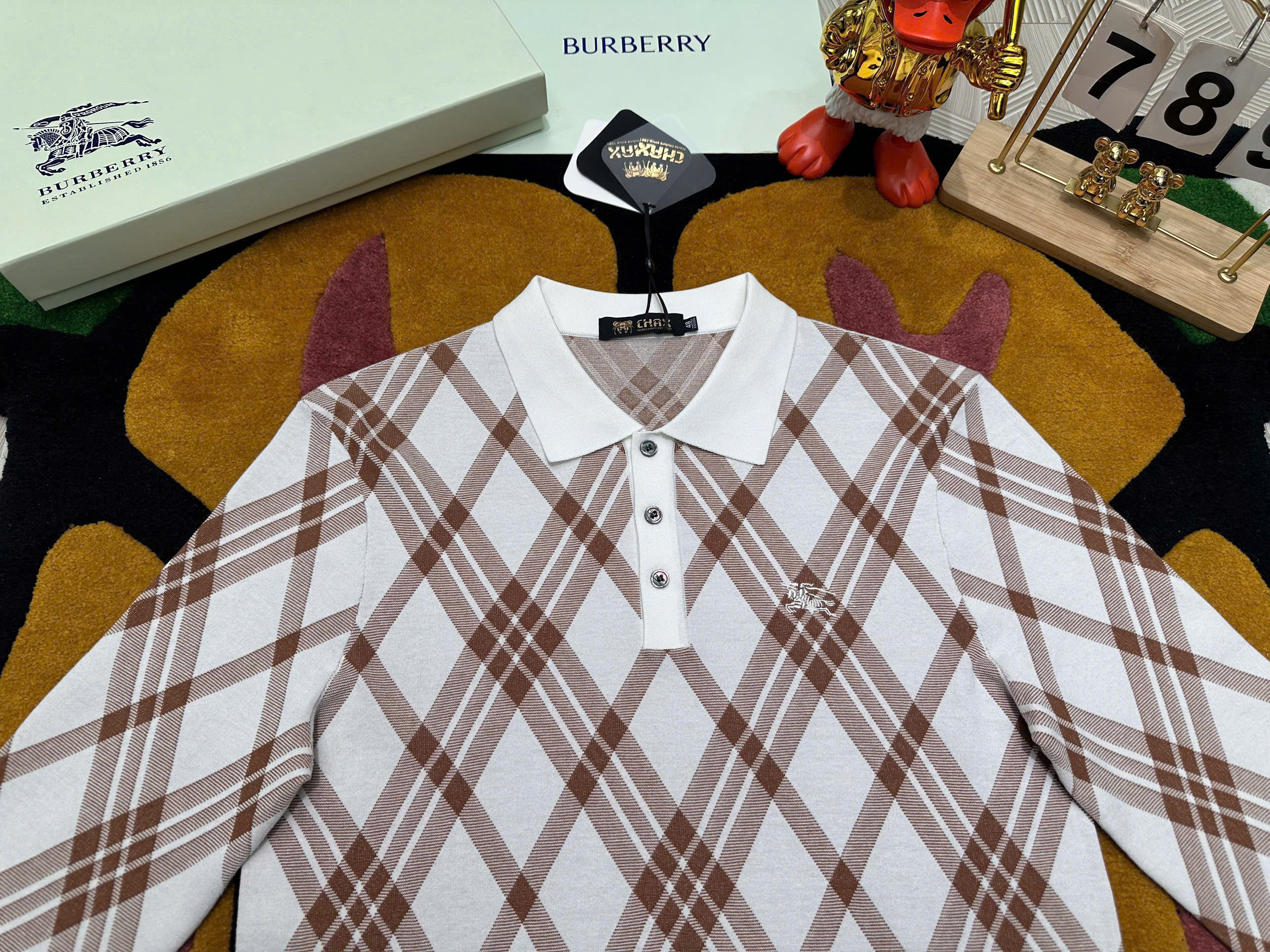 Áo polo len dài tay Burberry BBR  Trắng kẻ sọc chéo Like Auth 48-52 MK