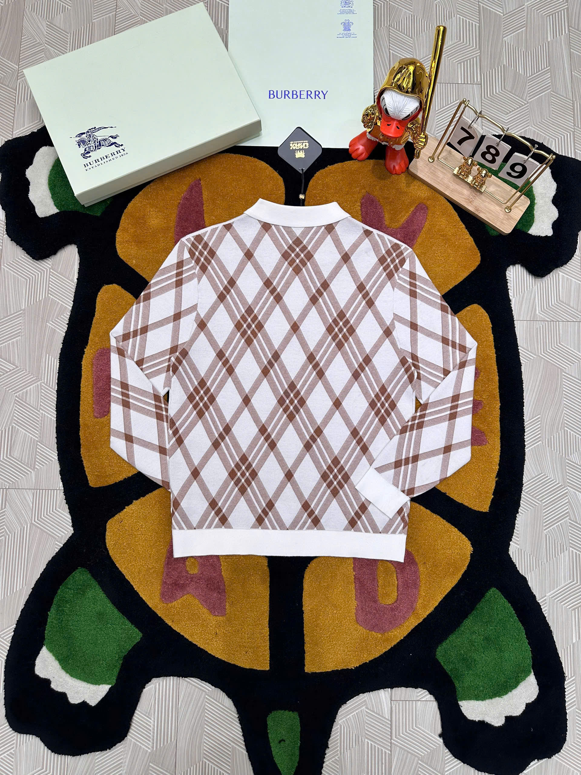 Áo polo len dài tay Burberry BBR  Trắng kẻ sọc chéo Like Auth 48-52 MK