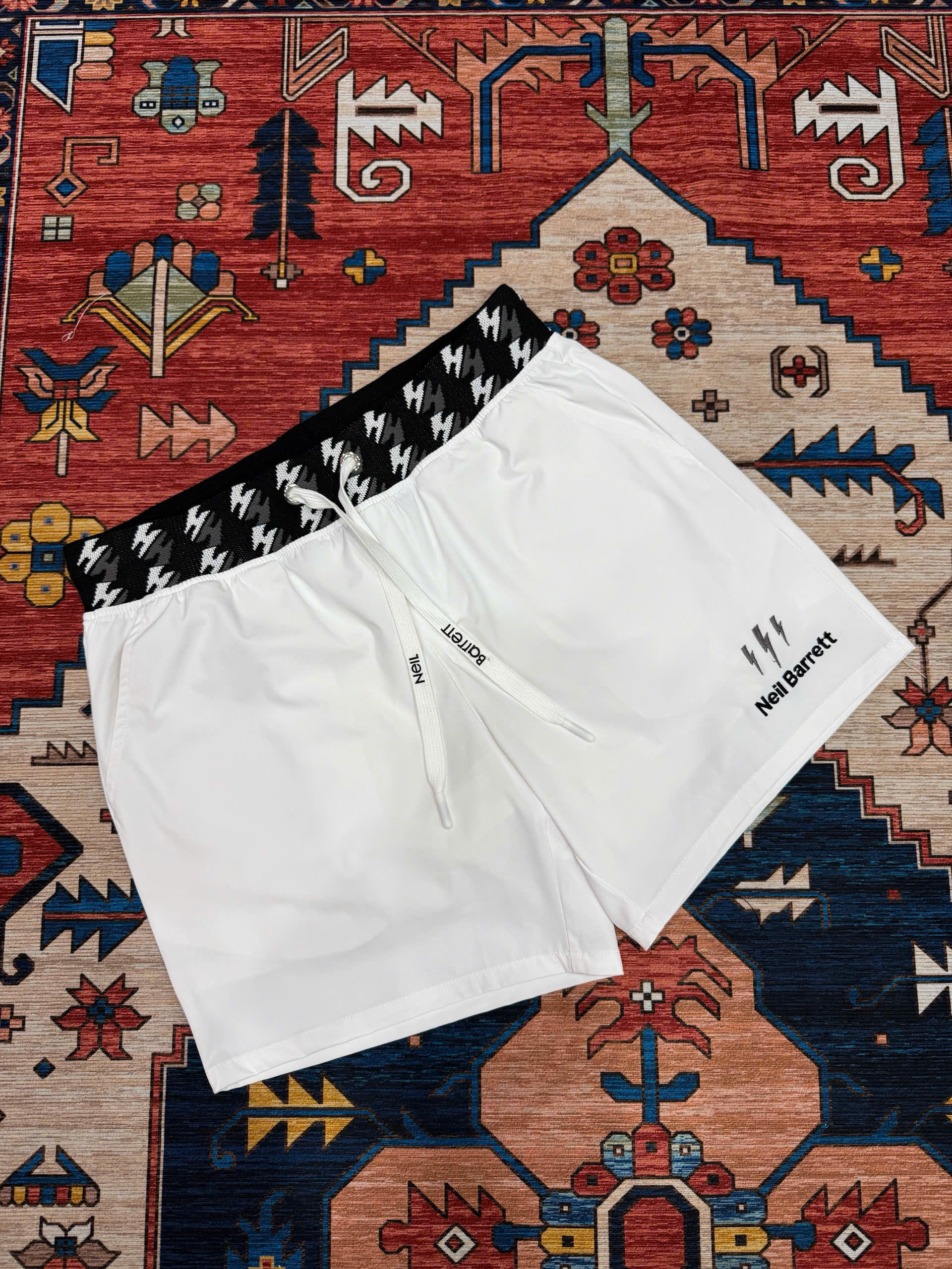 Quần short đùi gió Neil Barret check cạp logo thêu tia sét Like Auth S-XL MK