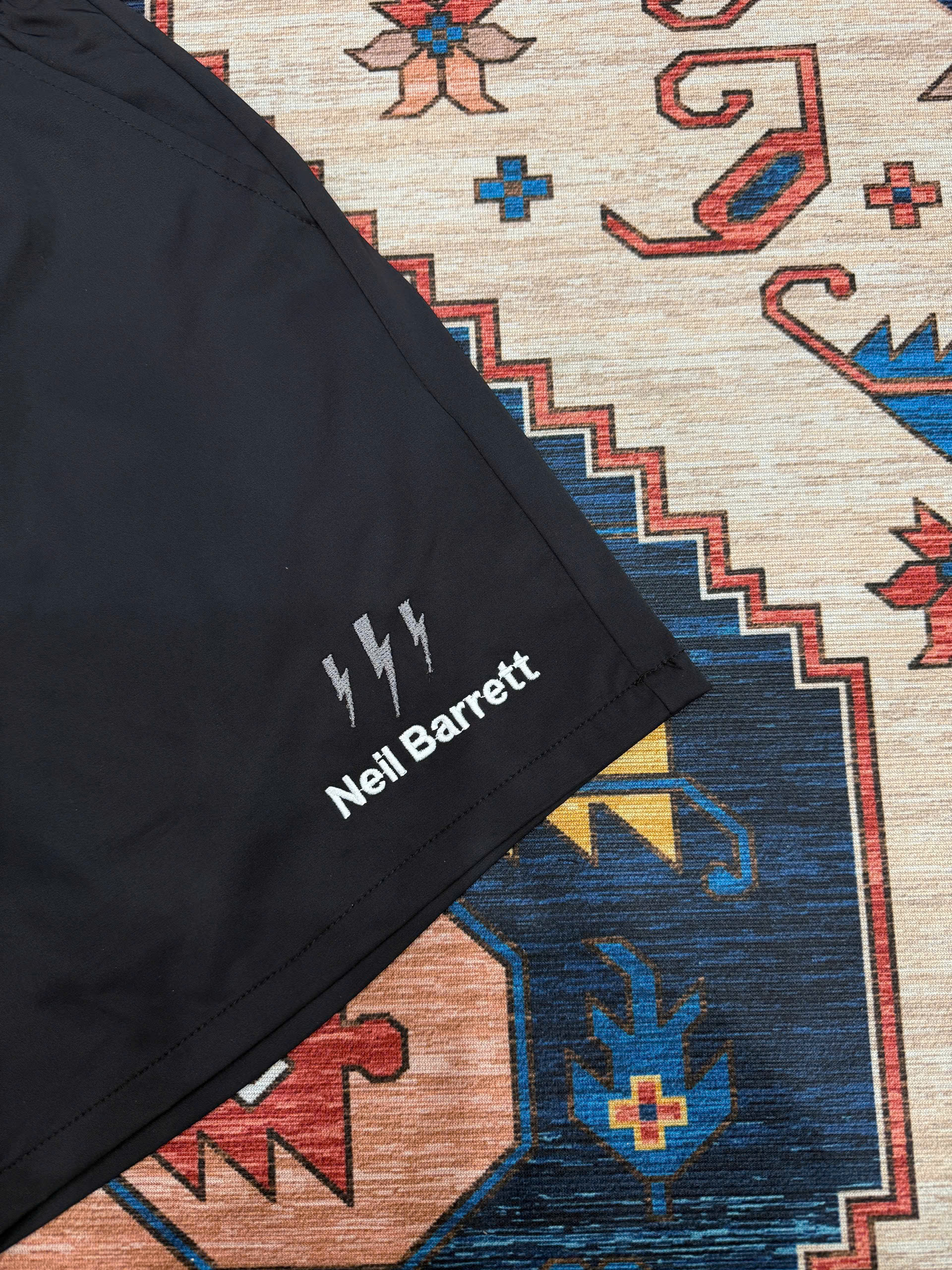 Quần short đùi gió Neil Barret check cạp logo thêu tia sét Like Auth S-XL MK