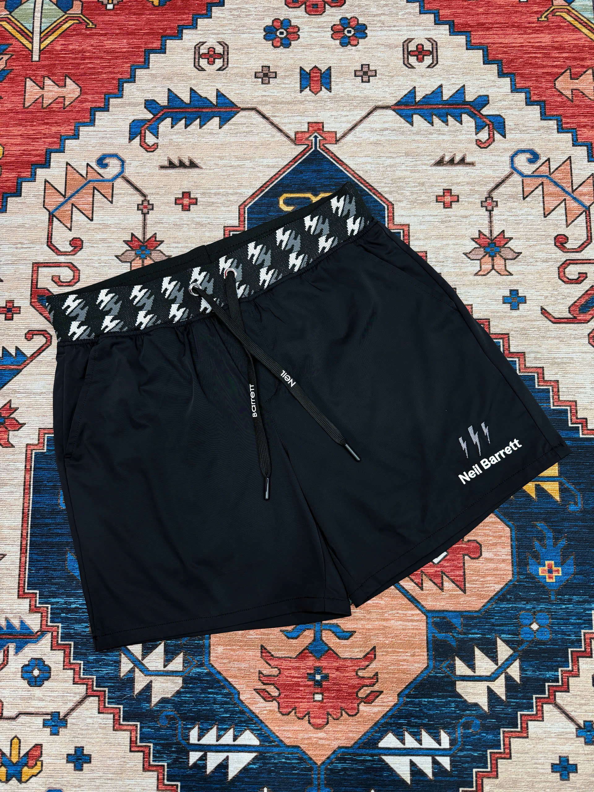 Quần short đùi gió Neil Barret check cạp logo thêu tia sét Like Auth S-XL MK