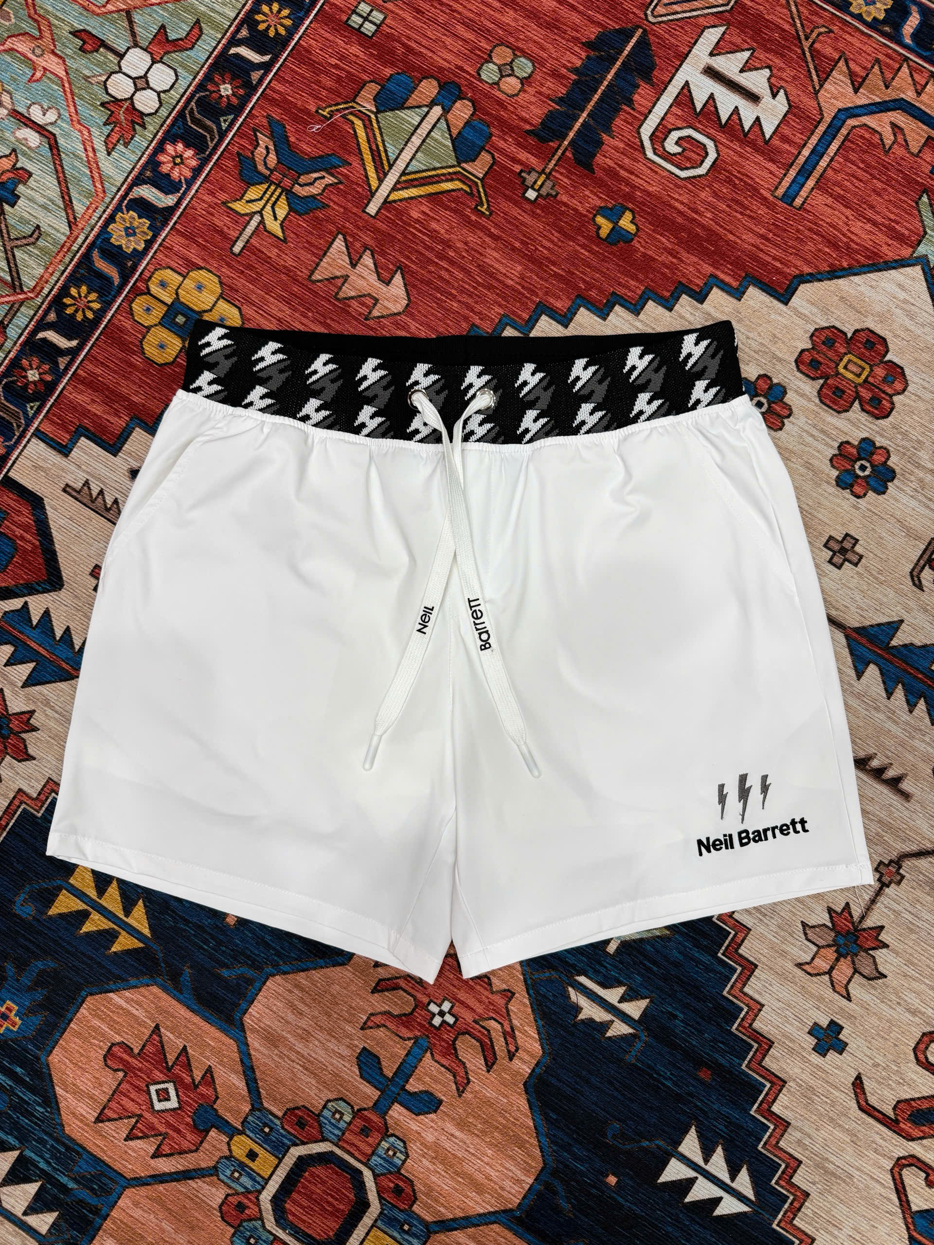 Quần short đùi gió Neil Barret check cạp logo thêu tia sét Like Auth S-XL MK