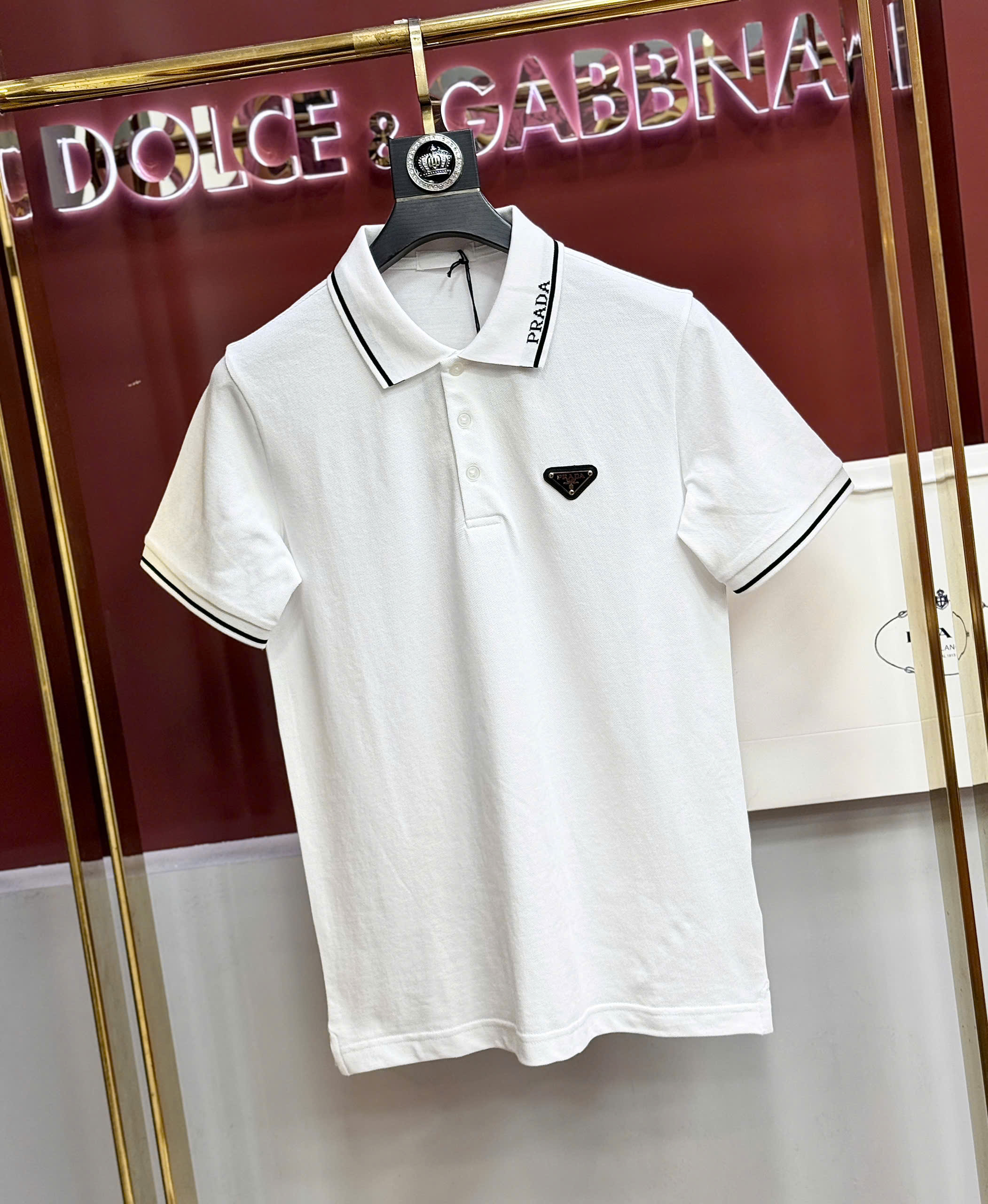 Áo polo Prada logo check cổ tag tam giác ngực Like Auth S-XL CD