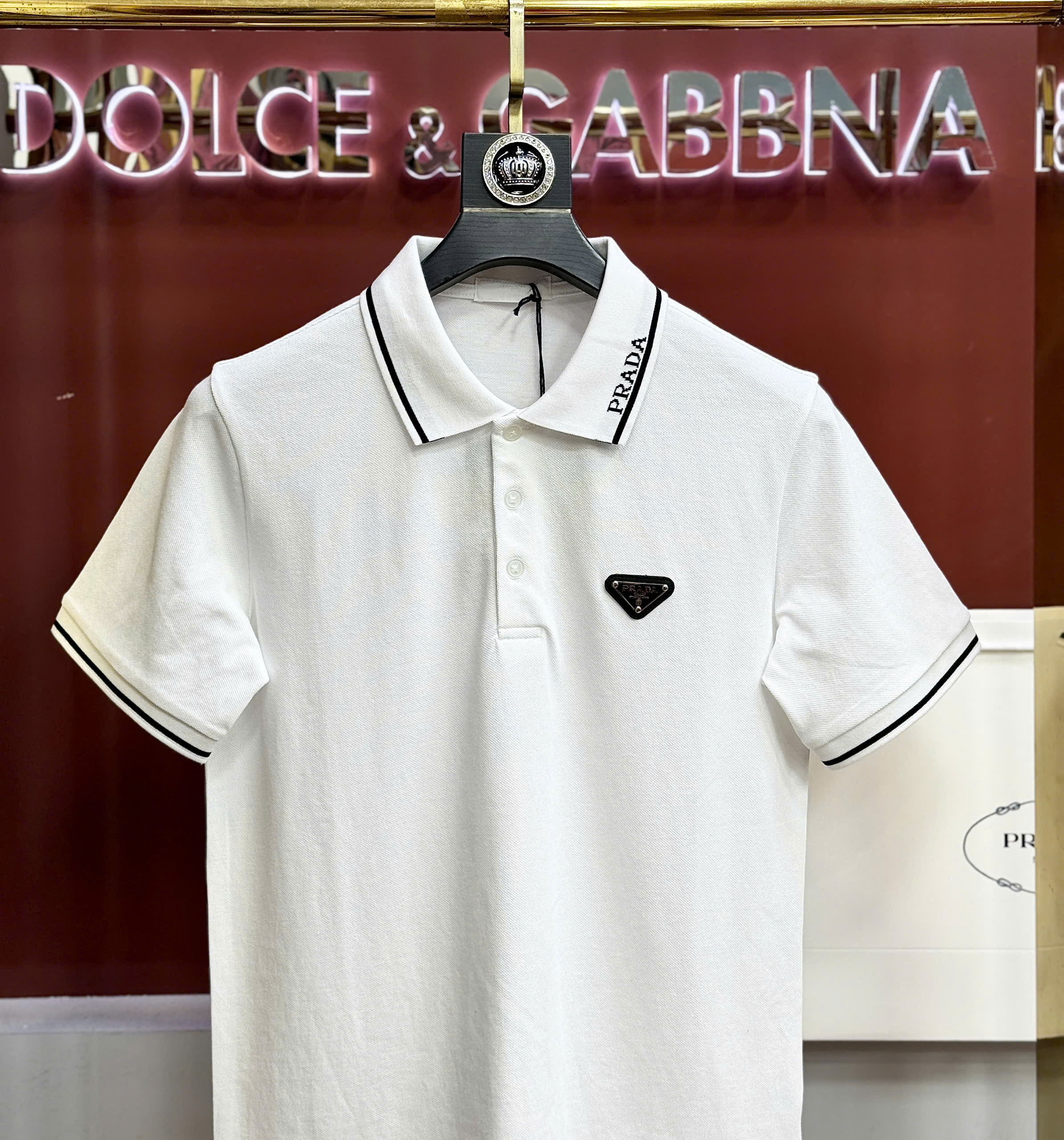 Áo polo Prada logo check cổ tag tam giác ngực Like Auth S-XL CD